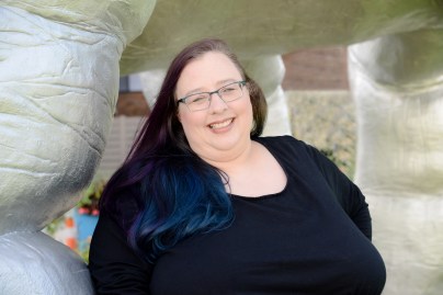 Nyla under the hand sculture at MOCA Cleveland