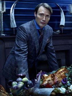 Hannibal standing over a roasted pig.
