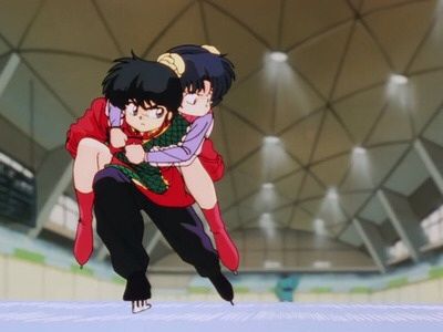 Ranma on ice skates carrying Akane on his back.